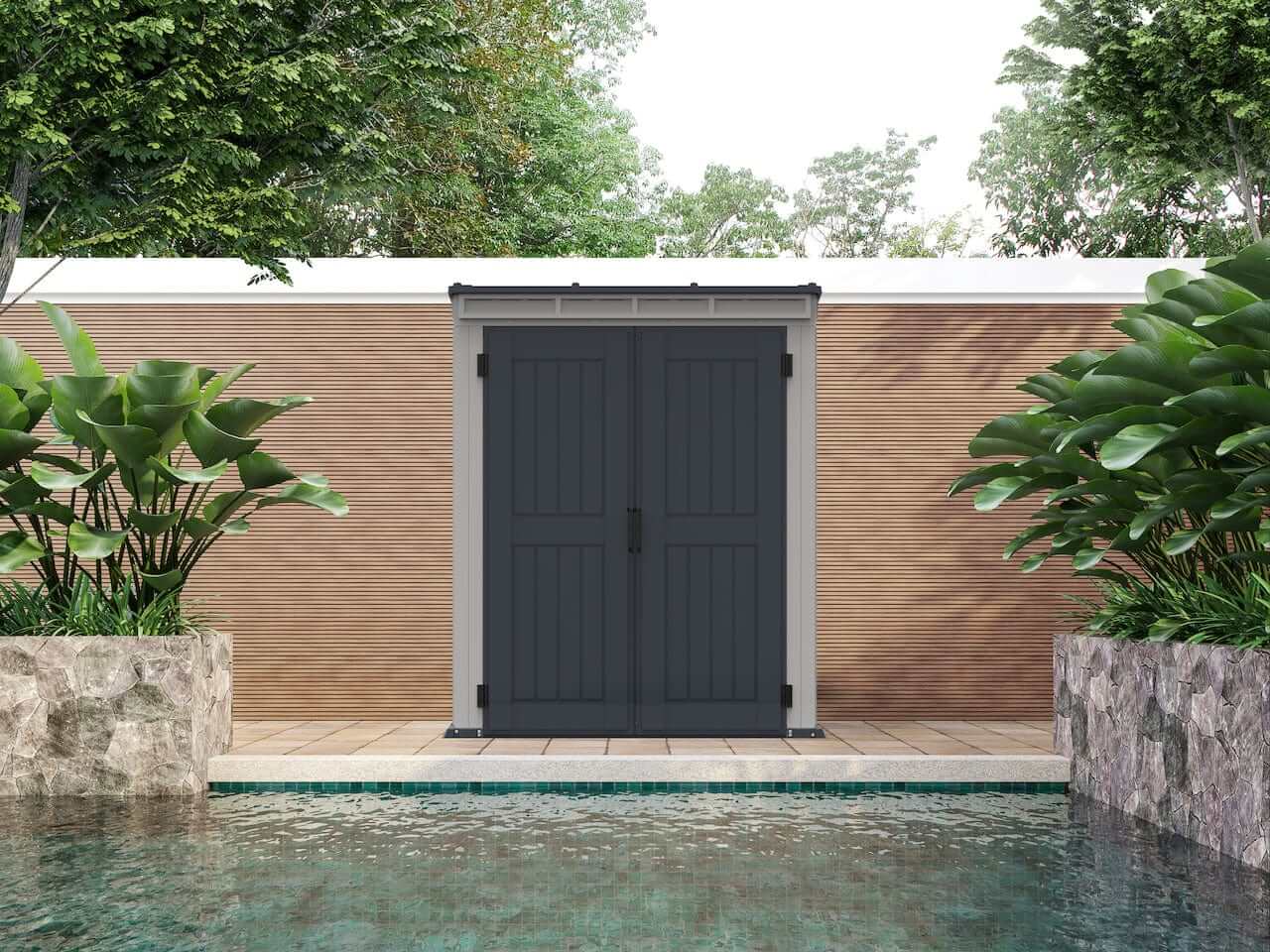 Duramax Vinyl Shed 5x3 YardMate with a stylish pent roof against a lush garden backdrop.