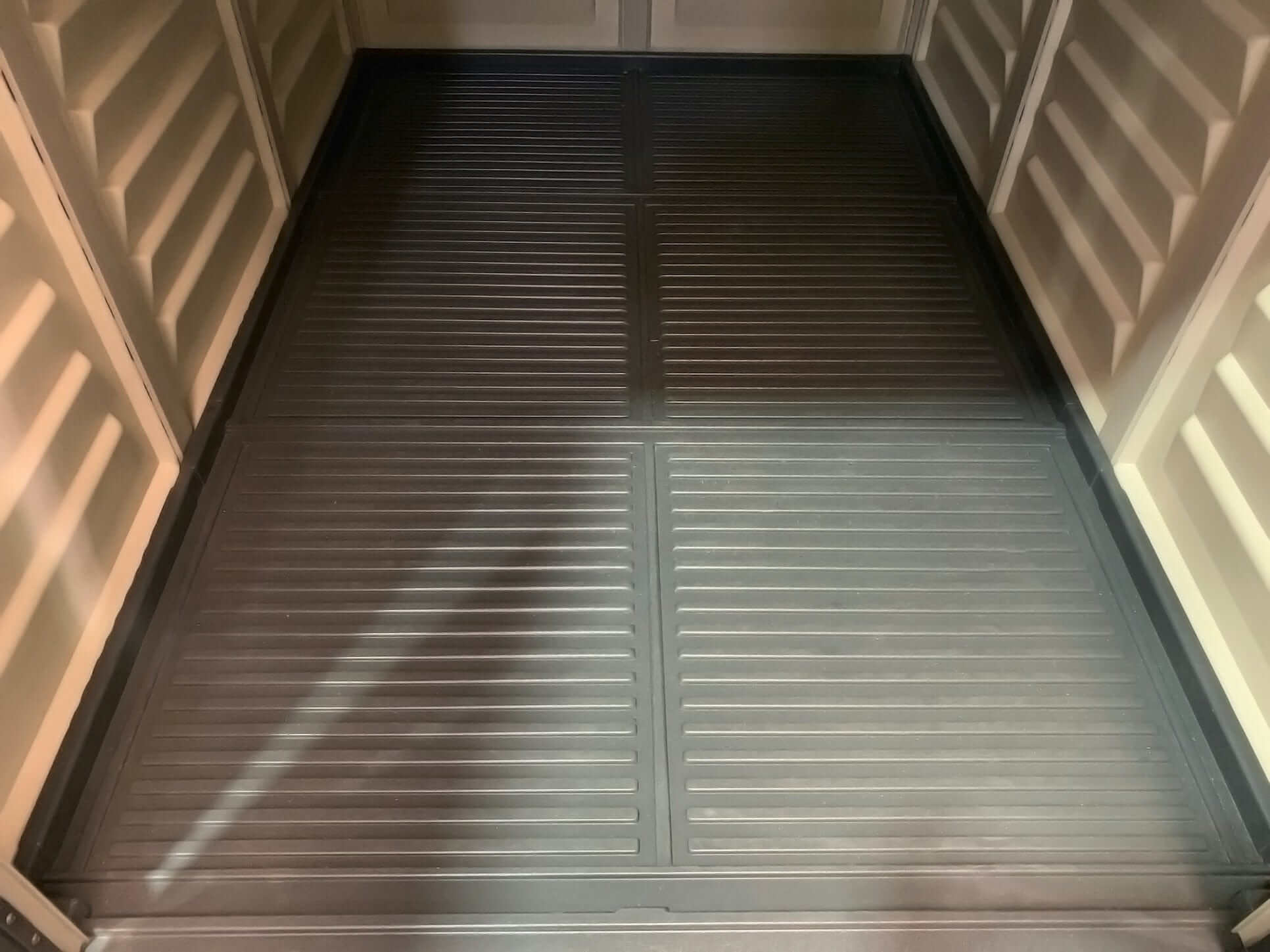 Duramax Vinyl Shed interior floor view showing durable, ribbed surface for optimal storage support.