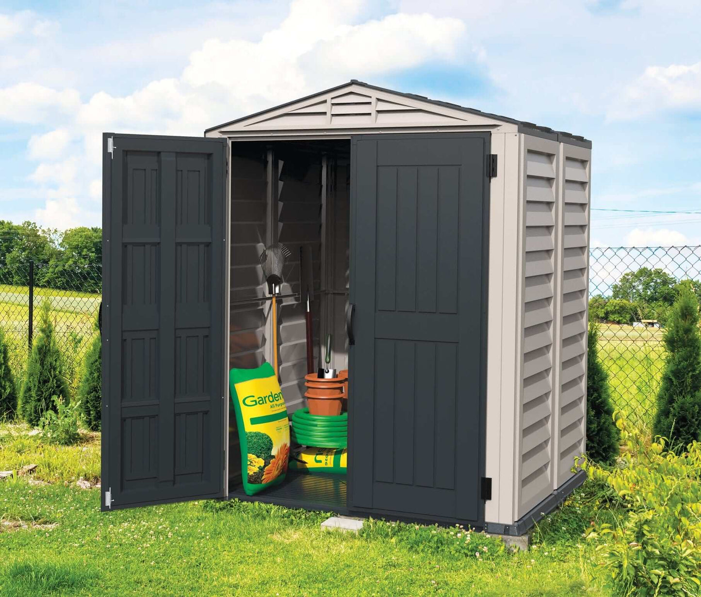 Duramax Vinyl Shed 5x5 YardMate Plus with tools and gardening supplies, ideal outdoor storage solution.