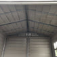 Interior view of Duramax Vinyl Shed with durable metal frame and spacious design.