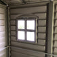 Interior view of Duramax Vinyl Shed showing a window for natural light and ventilation.