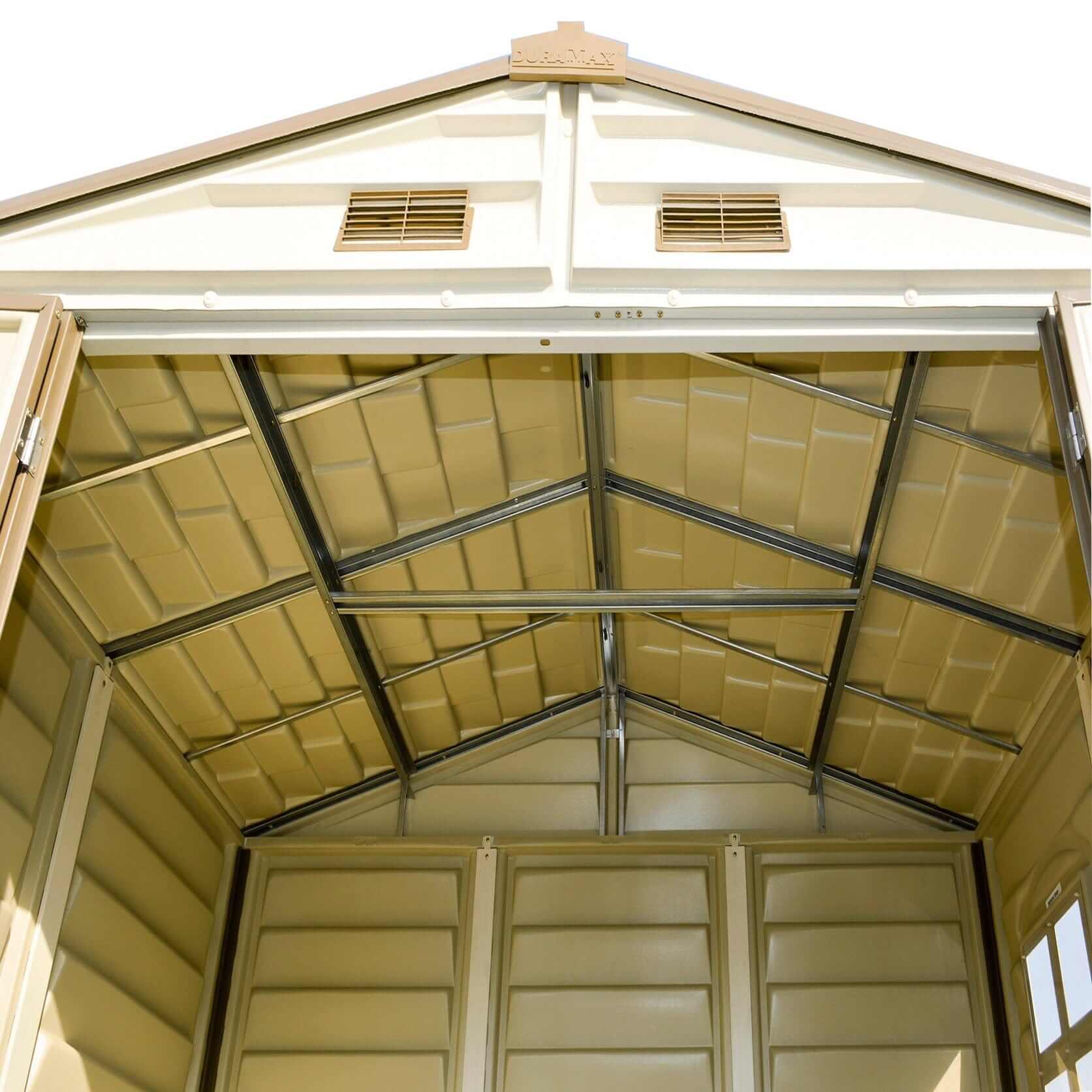 Interior view of the Duramax 8x6 StoreAll Vinyl Shed showing structural design and spacious storage area.