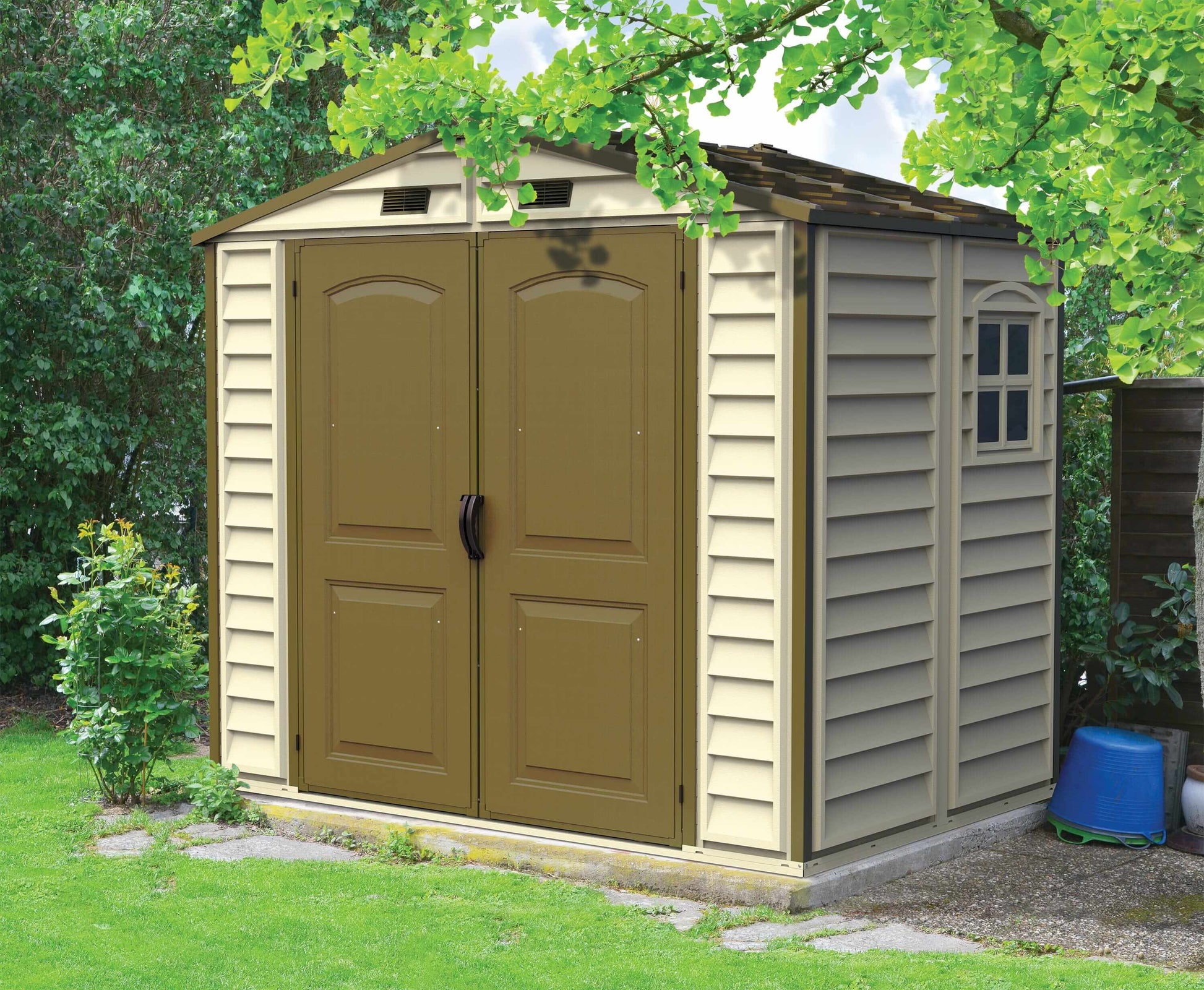 Duramax Vinyl Shed 8x6 StoreAll with foundation, perfect for outdoor storage in a backyard setting.