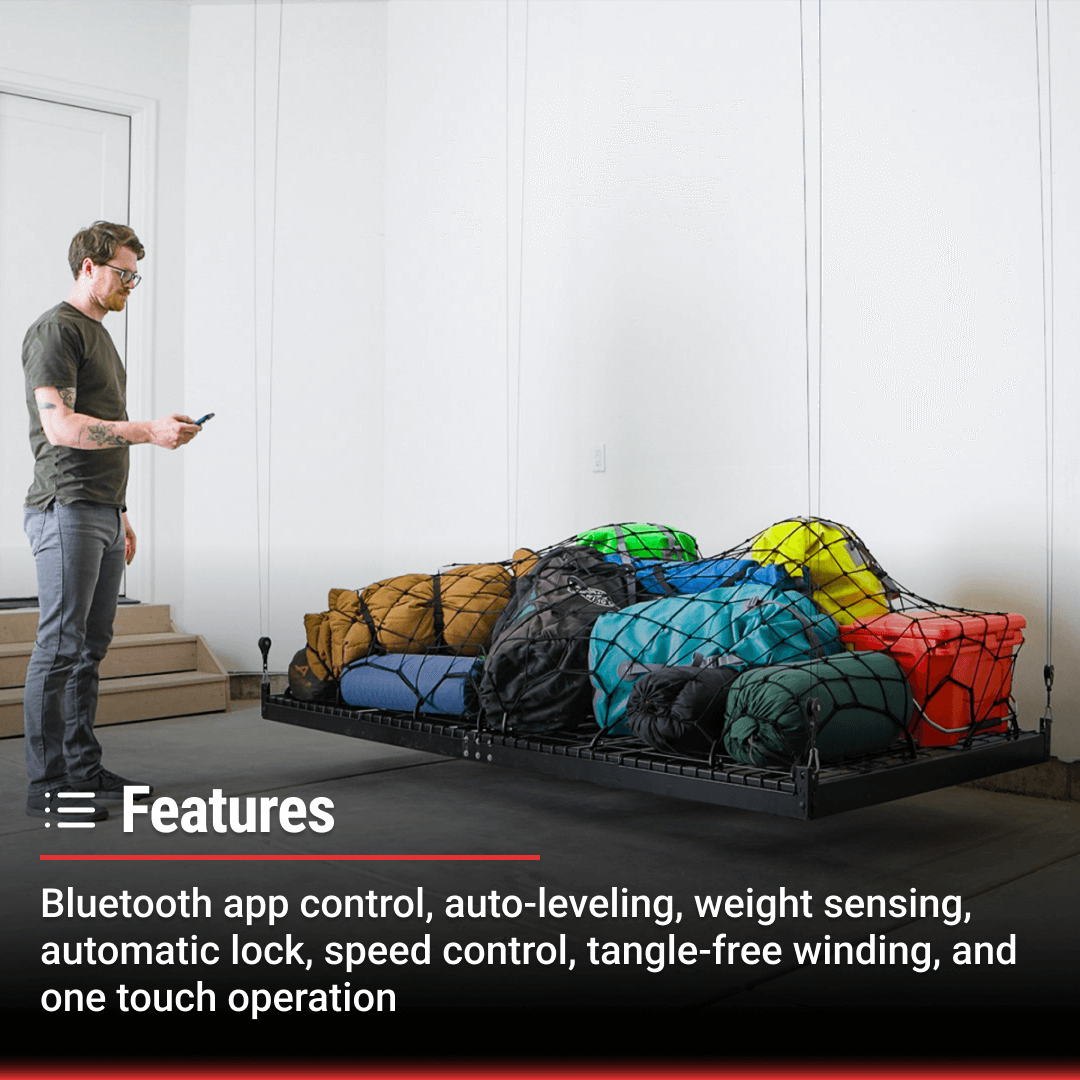 Man using Bluetooth app to control Garage Smart platform storage lifter with colorful bags.