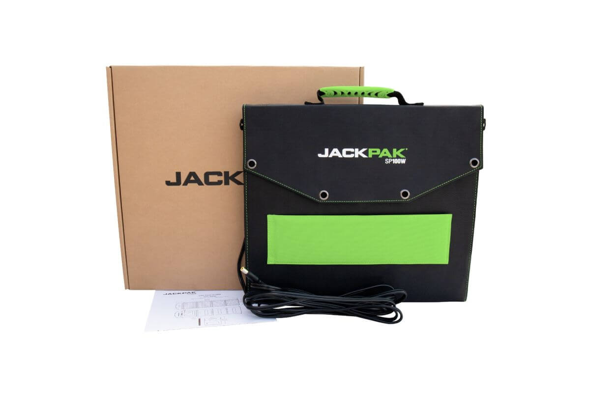 JackPak SP100W portable solar panel charger in its black and green carry case next to packaging box.