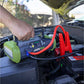 JackPak ULTRA2500A jump starter in use on a car engine with cables connected for emergency power.