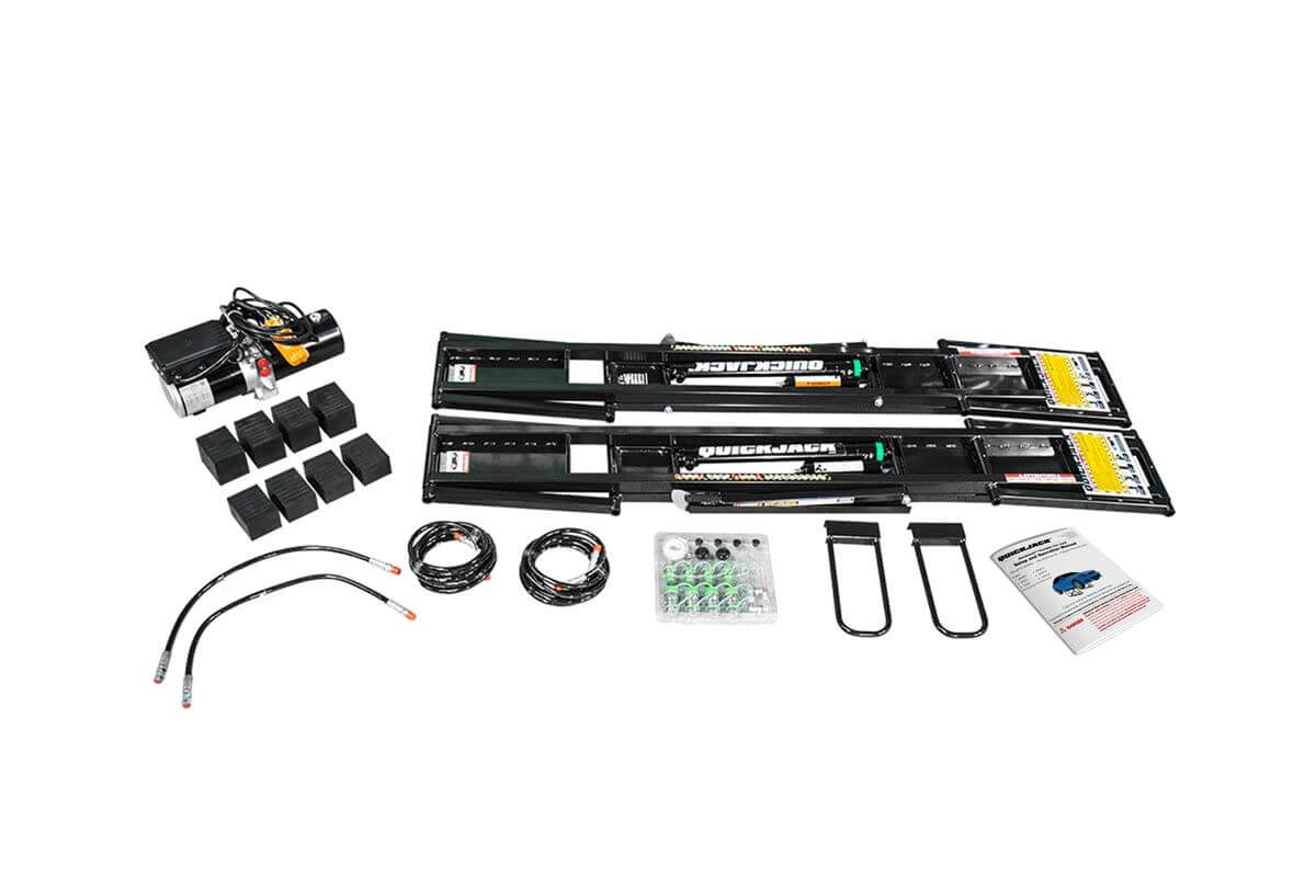 QuickJack 5000TL portable car lift parts and accessories kit, includes hydraulic system, rubber blocks, and instruction manual.