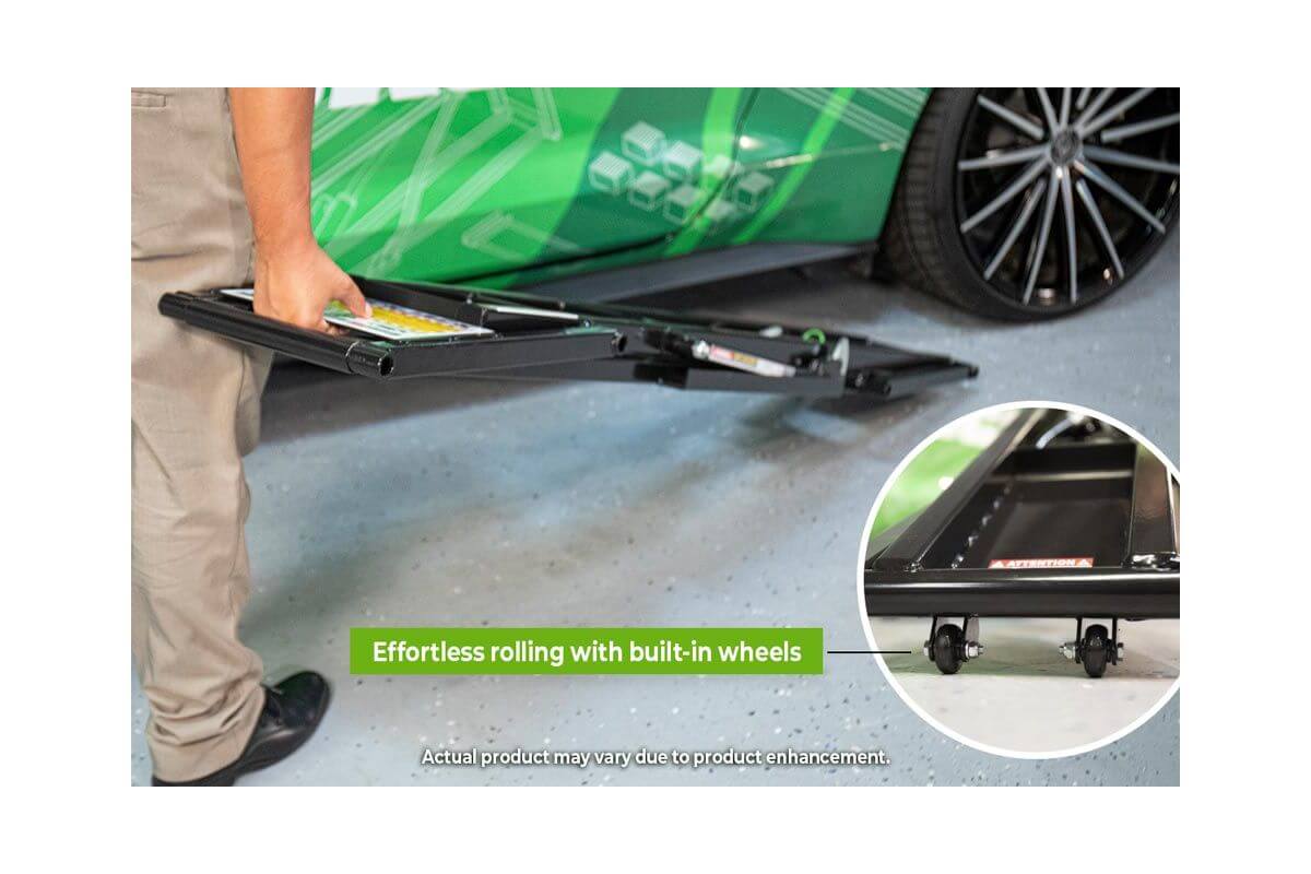 Portable car lift with built-in wheels for easy rolling and setup in the garage.