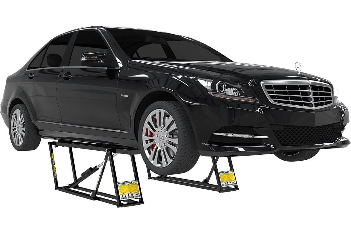 Portable car lift lifting a black sedan, showcasing its 5000 lb capacity and quick setup. 