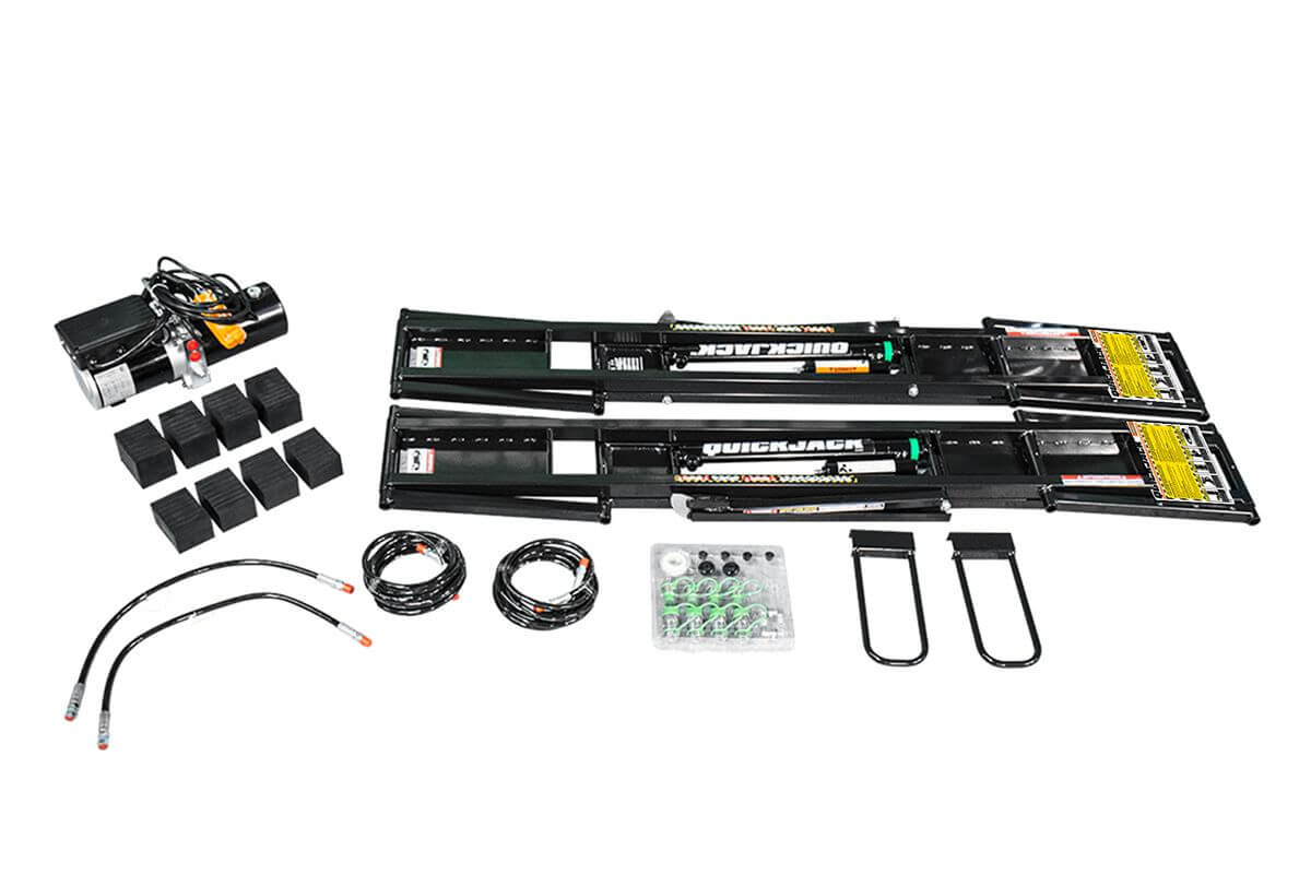 QuickJack 7000TL portable car lift components with hydraulic system and accessories for 7000 lb capacity.