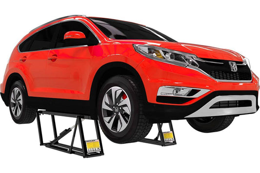 Honda SUV elevated on QuickJack 7000TL portable car lift, showcasing 7000 lb capacity and lifting height.