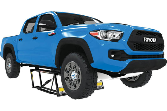 Blue Toyota Tacoma on QuickJack 7000TLX portable car lift showing extended reach and lifting capacity. 