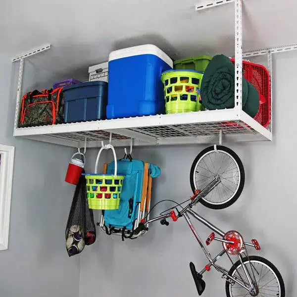 Overhead garage storage rack holding bins, baskets, and a bike, maximizing space and organization.