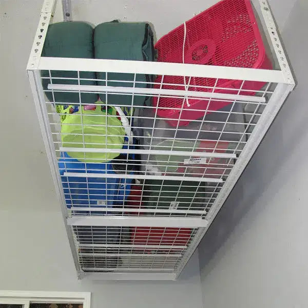 Overhead garage storage rack holding colorful bins and blankets, optimizing garage space and organization.