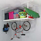 Overhead garage storage rack with colorful bins, a bike, and a kayak for efficient space utilization.