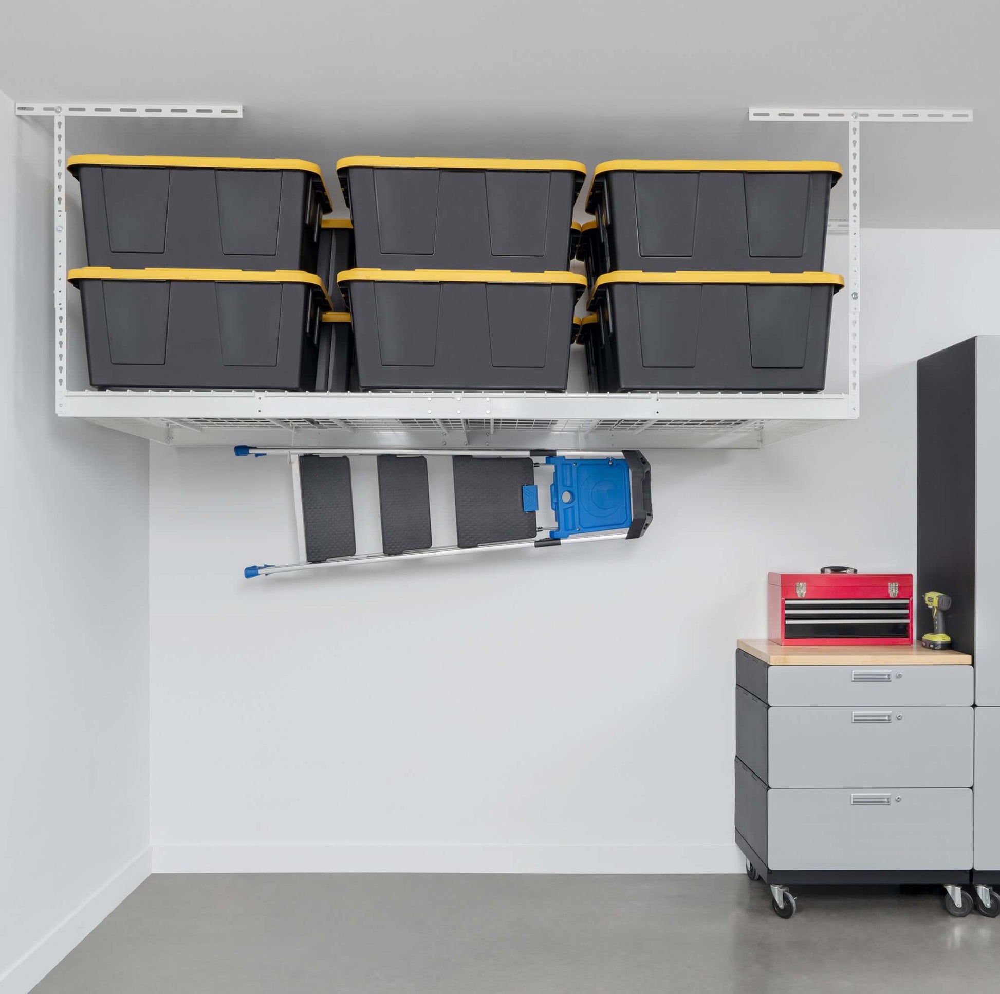 Overhead garage storage rack with black bins and a ladder, optimizing space and organization.