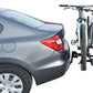 Motorized bike storage lift attached to a car, demonstrating easy overhead storage solutions for bikes.