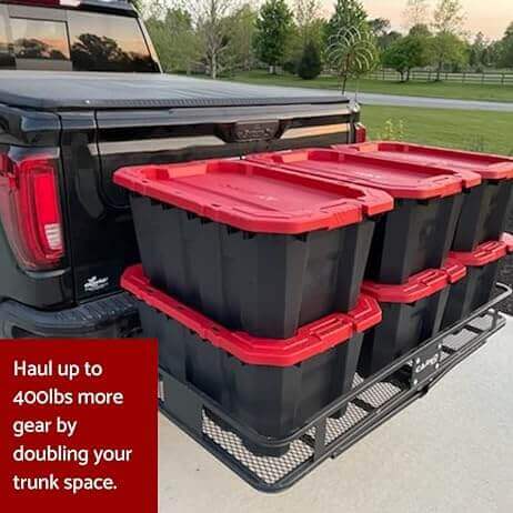 Black truck with red-top storage bins in a hitch carrier, showcasing increased trunk space and easy hauling.