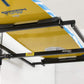 Motorized overhead storage lift by Top Shelf, holding a yellow surfboard securely in a garage.