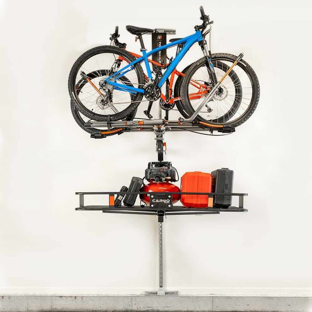 Motorized overhead storage lift by Top Shelf with bikes and tools, maximizing garage space effortlessly.