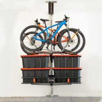 Motorized overhead storage lift holding bikes and storage bins, showcasing Top Shelf Storage Solutions - The Lift.