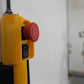 Yellow control panel for the Lift motorized garage storage system, enabling easy access with a push button.