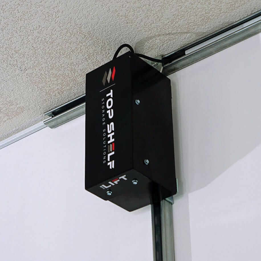 Top Shelf Storage Solutions Lift system, motorized overhead garage storage for bikes and tools.