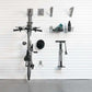 Bike stored on wall with storage hooks and accessories in a clean garage setting, showcasing the storeWALL Basic Bike Bundle.