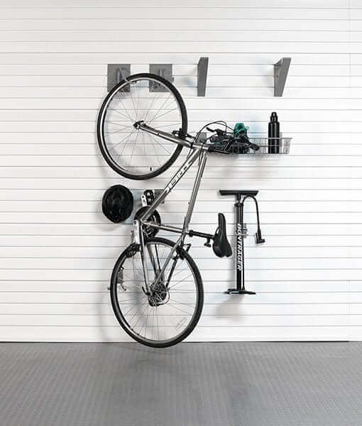 storeWALL Basic Bike Bundle showing a bike and accessories stored on the wall efficiently with hooks and a basket. 