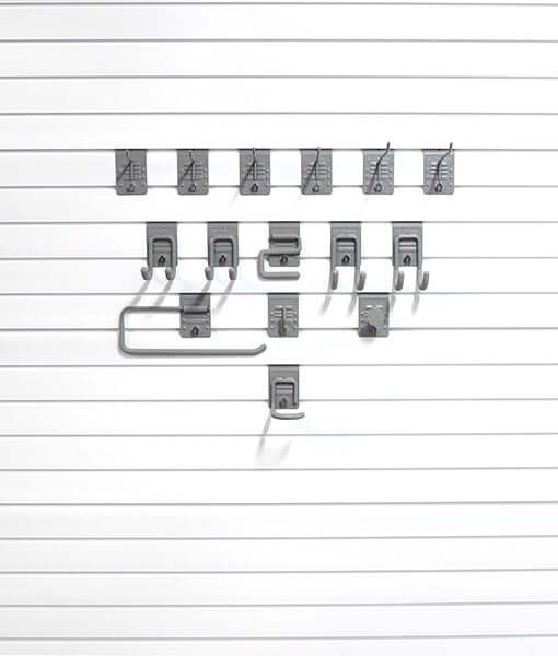 StoreWALL Basic Hook Bundle displaying various storage hooks on a slat wall for organizing tools and equipment. 