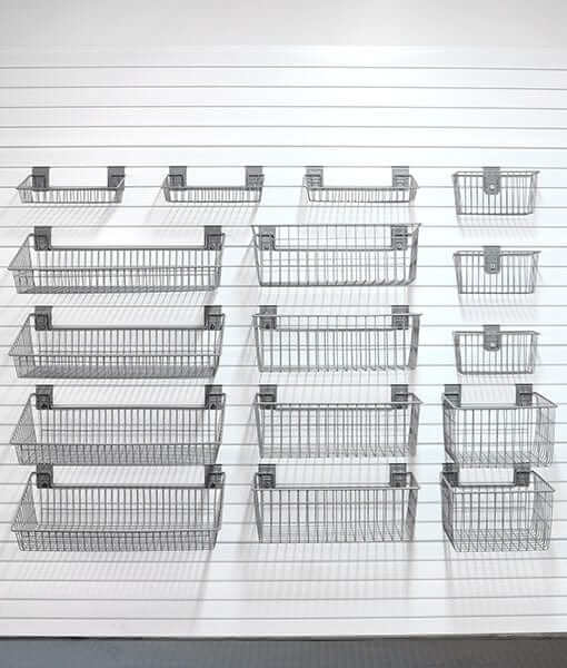 storeWALL Deluxe Garage Storage Baskets organized on slatwall, ideal for tools and sports equipment. 