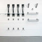 Wall-mounted bike storage solution featuring Steadyrack brackets and hooks for efficient organization.